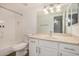 Clean bathroom featuring a shower-tub combo, a large mirror, granite countertop, and white cabinetry at 10610 S 48Th St # 1068, Phoenix, AZ 85044