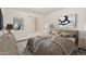 Serene bedroom with a queen bed, soft neutral tones, stylish decor, and natural light at 10610 S 48Th St # 1068, Phoenix, AZ 85044