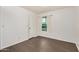 Bright bedroom features wood floors, natural light, and a window with curtains at 10610 S 48Th St # 1068, Phoenix, AZ 85044