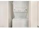 Compact laundry area with a stacked washer and dryer unit, perfect for space-saving efficiency at 10610 S 48Th St # 1068, Phoenix, AZ 85044