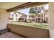 Private patio overlooking green common area, offering a serene outdoor living space at 10610 S 48Th St # 1068, Phoenix, AZ 85044