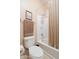 Well-lit bathroom featuring a toilet and a bathtub with shower and curtain at 12030 W Polk St, Avondale, AZ 85323