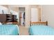 Polka dot themed bedroom with two twin beds, and closet view at 12030 W Polk St, Avondale, AZ 85323