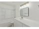 A bright bathroom features a large vanity and a tub and shower combo at 13202 N 40Th Pl, Phoenix, AZ 85032