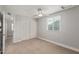 This bedroom features carpet, a ceiling fan, and a closet at 13202 N 40Th Pl, Phoenix, AZ 85032