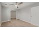 Bright bedroom features a ceiling fan and view into another room at 13202 N 40Th Pl, Phoenix, AZ 85032
