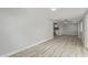 Large living room with a slider to the backyard, neutral paint, and wood-look flooring at 13202 N 40Th Pl, Phoenix, AZ 85032