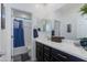 Bathroom featuring a single vanity, bathtub, shower and blue accents at 14188 W Artemisa Ave, Surprise, AZ 85387