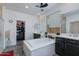 Bright bathroom featuring a large soaking tub, dual vanities, walk-in closet and neutral color palette at 14188 W Artemisa Ave, Surprise, AZ 85387