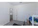 Empty bedroom with minimal furniture and neutral walls and carpet at 14188 W Artemisa Ave, Surprise, AZ 85387