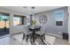 Charming dining area features a modern table, stylish chairs, and decorative accents at 14188 W Artemisa Ave, Surprise, AZ 85387