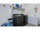 Laundry room equipped with newer front load washer and dryer at 14188 W Artemisa Ave, Surprise, AZ 85387