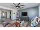 Cozy living room with comfortable seating, decorative accents, and ample natural light at 14188 W Artemisa Ave, Surprise, AZ 85387