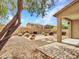 Large backyard with stone patio, perfect for outdoor entertaining in a drought-tolerant setting at 15093 W Glenrosa Ave, Goodyear, AZ 85395