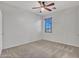 Comfortable bedroom featuring neutral walls, carpet, a ceiling fan, and natural light at 15093 W Glenrosa Ave, Goodyear, AZ 85395