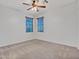 Neutral bedroom featuring carpet flooring, ceiling fan, and window with blinds at 15093 W Glenrosa Ave, Goodyear, AZ 85395