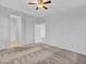 Bedroom featuring carpet flooring, a ceiling fan, and multiple doors at 15093 W Glenrosa Ave, Goodyear, AZ 85395
