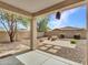 View of the backyard and patio featuring decorative brick and drought-tolerant landscaping at 15093 W Glenrosa Ave, Goodyear, AZ 85395