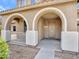 Welcoming front porch featuring arched entryways and a well-maintained facade at 15093 W Glenrosa Ave, Goodyear, AZ 85395
