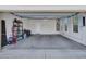 Spacious two car garage featuring bright interior and side storage shelves at 15093 W Glenrosa Ave, Goodyear, AZ 85395