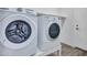 Bright laundry room featuring modern washer and dryer units at 15093 W Glenrosa Ave, Goodyear, AZ 85395