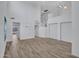 Spacious living room features a soaring ceiling, staircase, and wood-look tile flooring at 15093 W Glenrosa Ave, Goodyear, AZ 85395