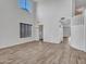 Open-concept living room with abundant natural light, high ceilings, and modern finishes at 15093 W Glenrosa Ave, Goodyear, AZ 85395
