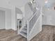 Carpeted staircase with white railing, seamlessly connects the home's levels at 15093 W Glenrosa Ave, Goodyear, AZ 85395