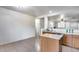 Open concept kitchen with an island and plenty of countertop space, ideal for entertaining at 15155 W Desert Hills Dr, Surprise, AZ 85379