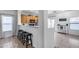 Eat-in kitchen with breakfast bar, offering extra seating and seamless flow to living areas at 15155 W Desert Hills Dr, Surprise, AZ 85379