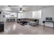 Spacious living room with modern furnishings, tile floors, and neutral decor throughout at 15155 W Desert Hills Dr, Surprise, AZ 85379