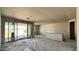 View of a spacious living room under construction with sliding glass doors and drywall at 15776 W Beryl Ave, Waddell, AZ 85355