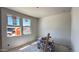 This room is in progress, showing windows, drywall, and construction materials at 15776 W Beryl Ave, Waddell, AZ 85355