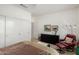 Cozy bedroom featuring a ceiling fan, chair, and plenty of natural light at 15936 W Clear Canyon Dr, Surprise, AZ 85374