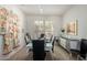 Bright dining area with a glass-top table, seating for six, and natural light at 15936 W Clear Canyon Dr, Surprise, AZ 85374