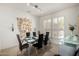 Elegant dining room with seating for six and shuttered windows at 15936 W Clear Canyon Dr, Surprise, AZ 85374