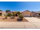 Charming home featuring a well-manicured yard, offering great curb appeal in a welcoming neighborhood at 15936 W Clear Canyon Dr, Surprise, AZ 85374