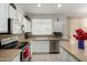 Updated kitchen with stainless steel appliances, granite countertops, and ample storage space at 15936 W Clear Canyon Dr, Surprise, AZ 85374