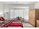 Bright main bedroom with a cozy desk area, a ceiling fan, and neutral carpet at 15936 W Clear Canyon Dr, Surprise, AZ 85374