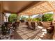 Inviting covered patio with comfortable seating and beautiful outdoor views at 15936 W Clear Canyon Dr, Surprise, AZ 85374