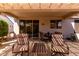Comfortable covered patio seating area, ideal for enjoying outdoor meals and gatherings with Gathering and friends at 15936 W Clear Canyon Dr, Surprise, AZ 85374