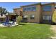 Expansive backyard featuring a pool, basketball court and covered patio in a desert home at 16401 S 29Th Dr, Phoenix, AZ 85045