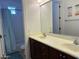 Bright bathroom with double vanity, large mirror, and a shower-tub combination at 16401 S 29Th Dr, Phoenix, AZ 85045