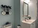 Charming bathroom featuring stylish decor, a modern vanity, sink, and tile flooring at 16401 S 29Th Dr, Phoenix, AZ 85045