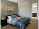 Relaxing bedroom suite with soft lighting and an en-suite bathroom at 16401 S 29Th Dr, Phoenix, AZ 85045