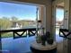 A modern dining table centerpiece with a view of the pool and backyard at 16401 S 29Th Dr, Phoenix, AZ 85045