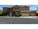 Charming two-story home with a three car garage and stone accents on the facade at 16401 S 29Th Dr, Phoenix, AZ 85045
