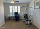 Home gym with natural light, a workstation, and an exercise machine at 16401 S 29Th Dr, Phoenix, AZ 85045