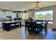 Spacious kitchen and dining area with views of the mountains and backyard landscaping at 16401 S 29Th Dr, Phoenix, AZ 85045