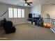 Cozy loft area with neutral carpet, comfortable seating, and views of the lower level at 16401 S 29Th Dr, Phoenix, AZ 85045